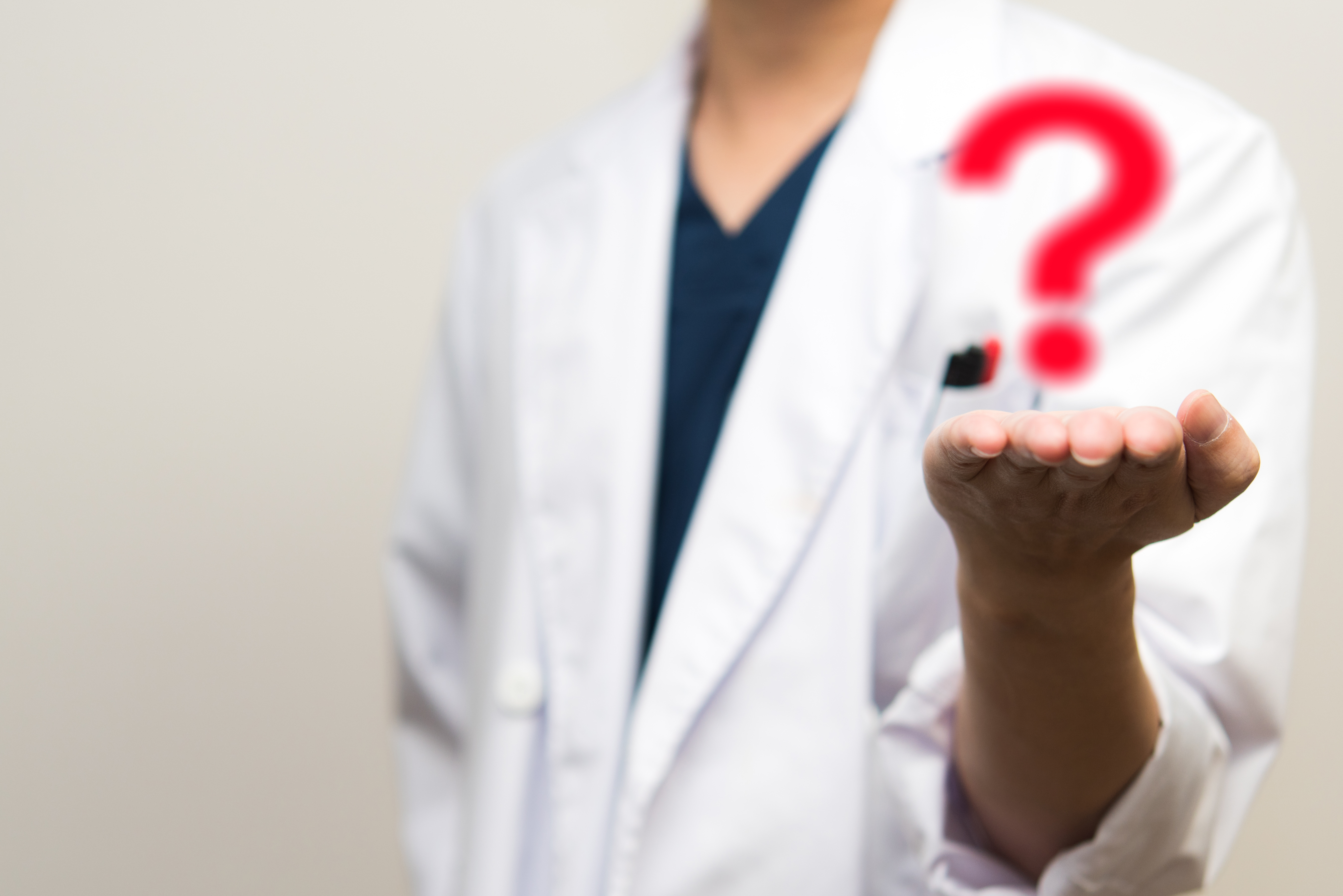 Woman holds Question Mark for Auto Accident FAQ 